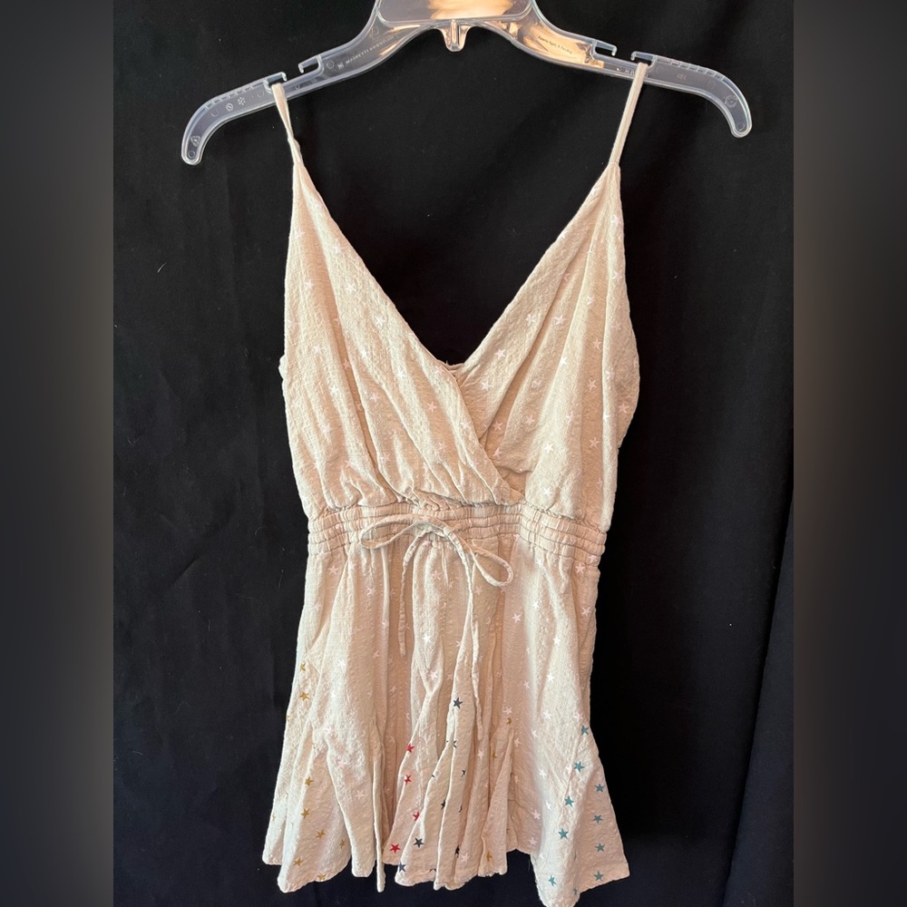 Tan Romper with multicolored star print